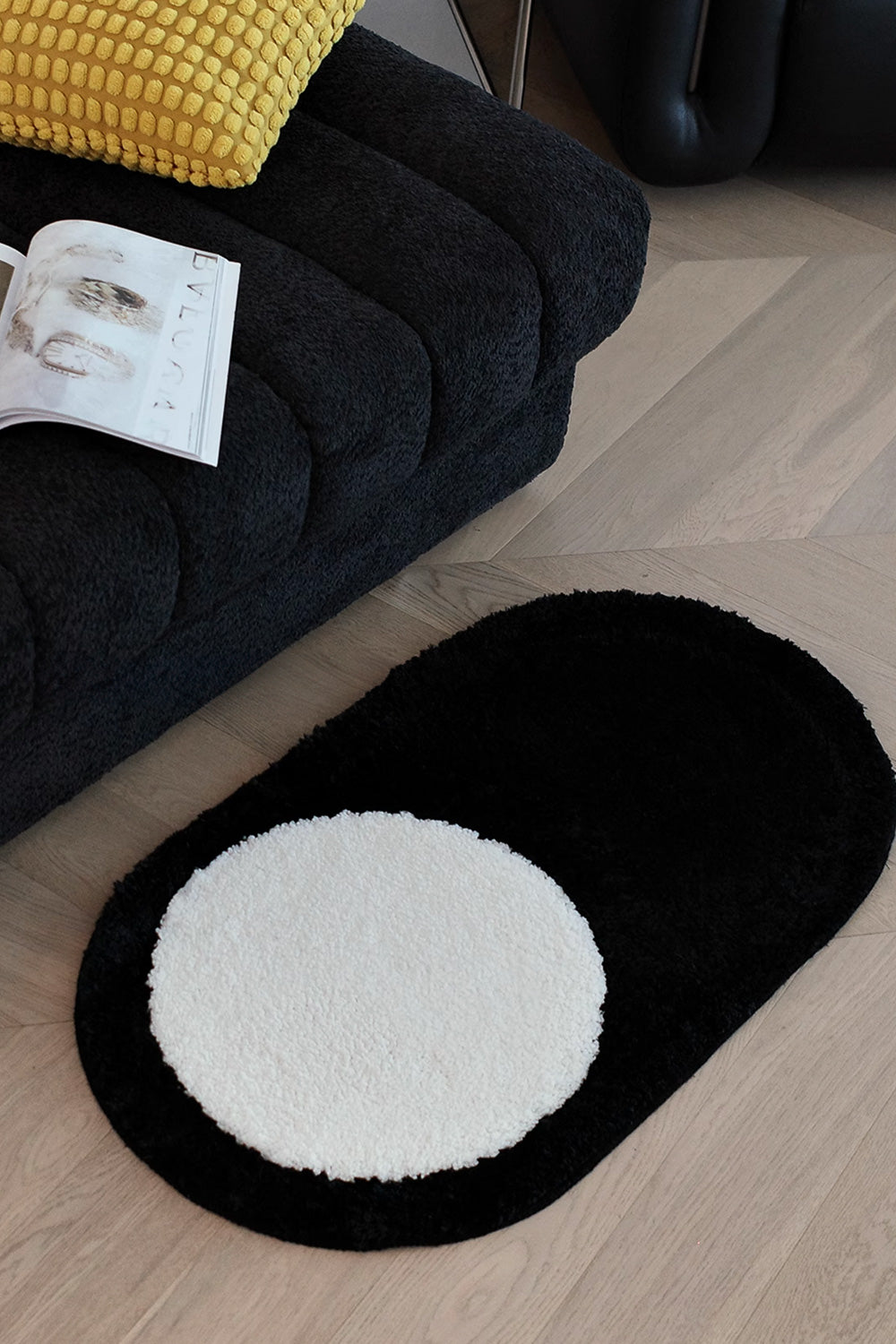White Circle on Black Oval Mat